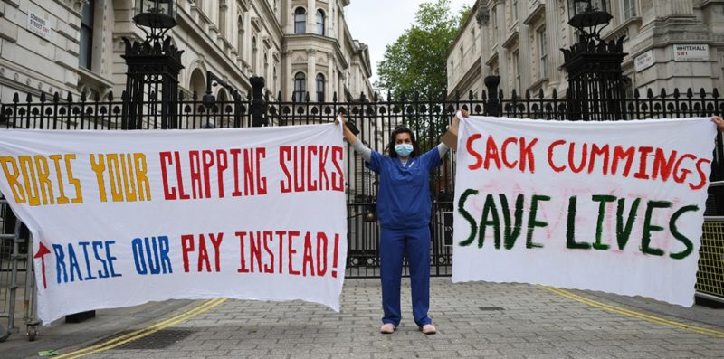 Nurse Ameera Sheikh protests outside Downing Street, Morning Star image
