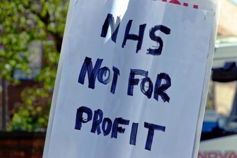 Placard stating NHS Not For Profit